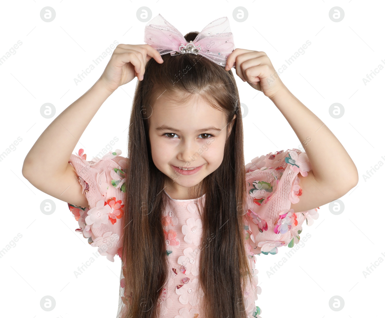 Photo of Happy little girl wearing beautiful hair accessory on white background