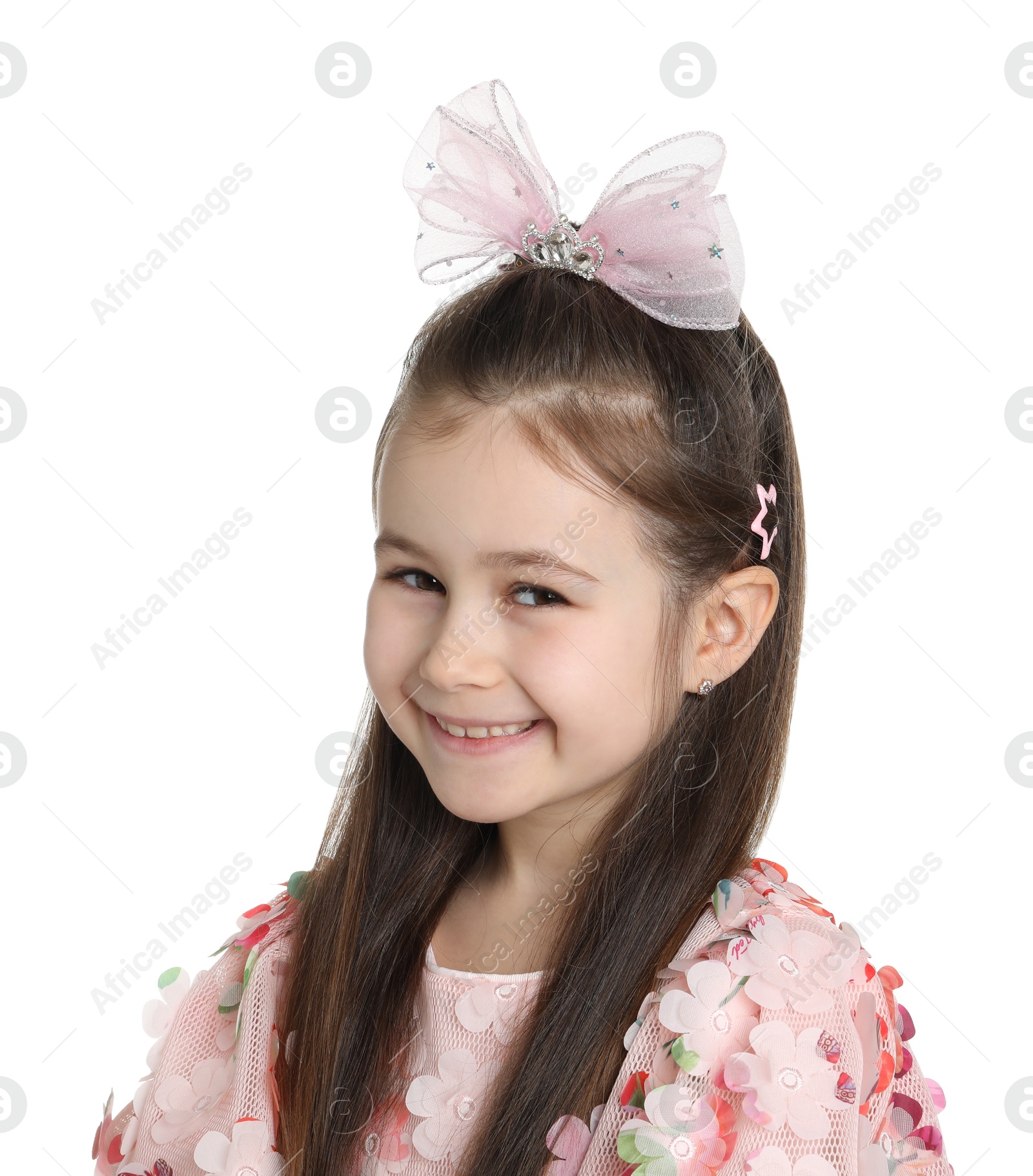 Photo of Happy little girl wearing beautiful hair accessories on white background