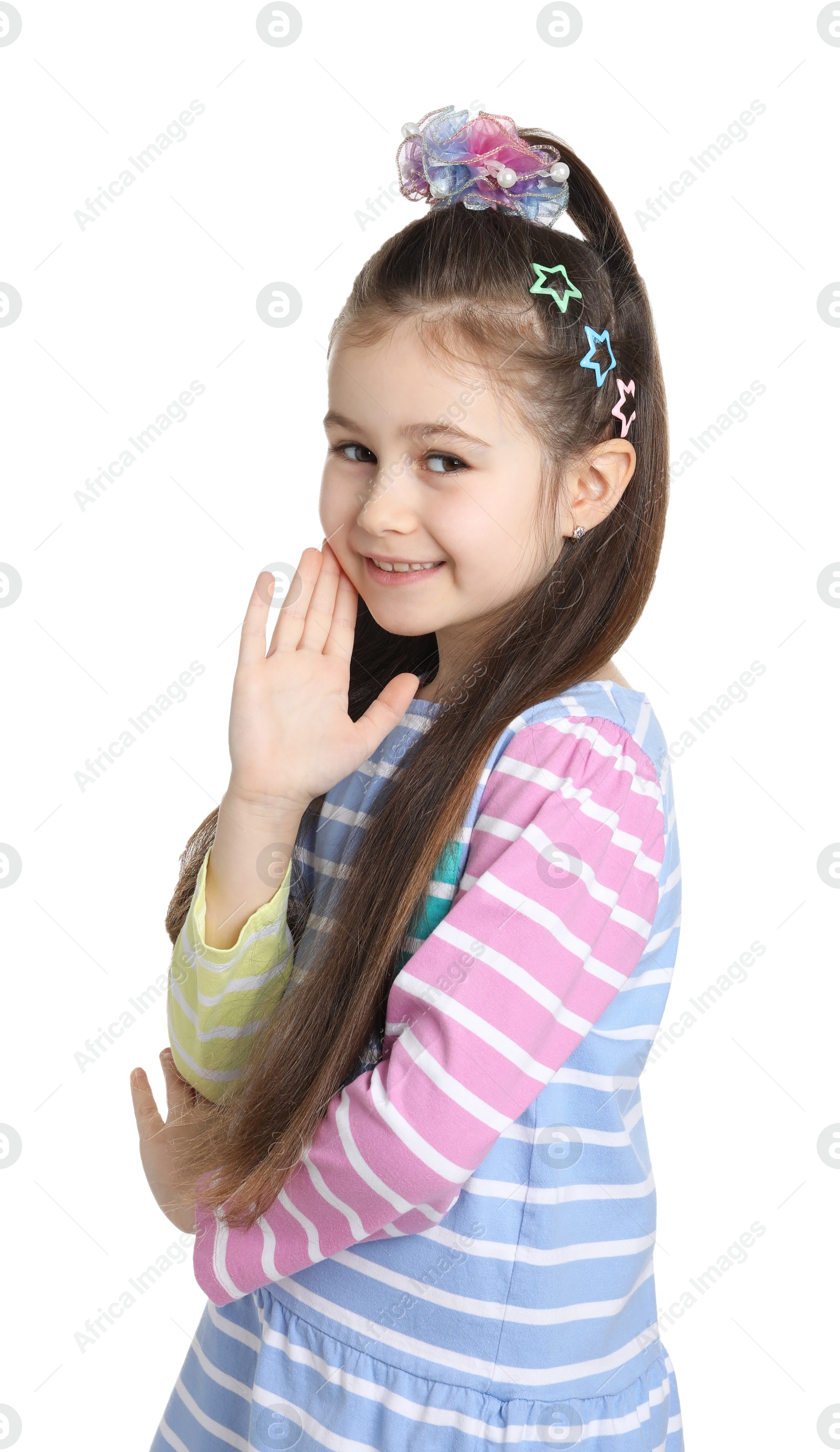 Photo of Happy little girl wearing beautiful hair accessories on white background