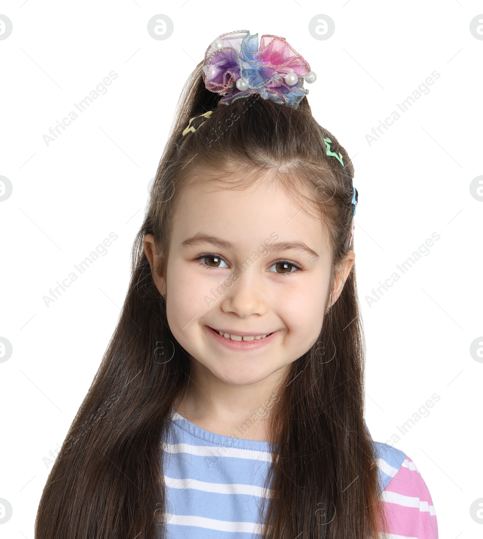 Photo of Happy little girl wearing beautiful hair accessories on white background