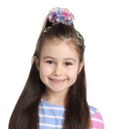 Photo of Happy little girl wearing beautiful hair accessories on white background