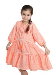 Happy little girl wearing beautiful hair accessories on white background