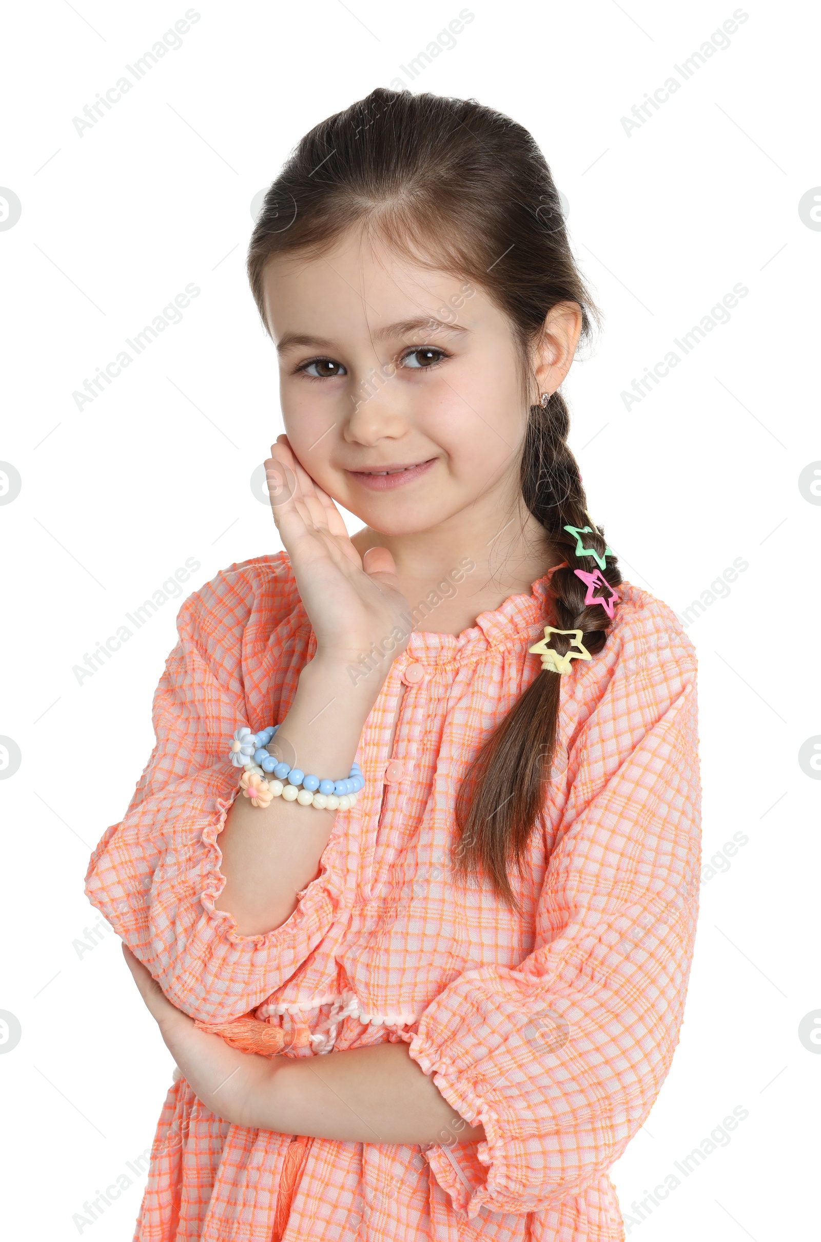 Photo of Happy little girl wearing beautiful hair accessories on white background