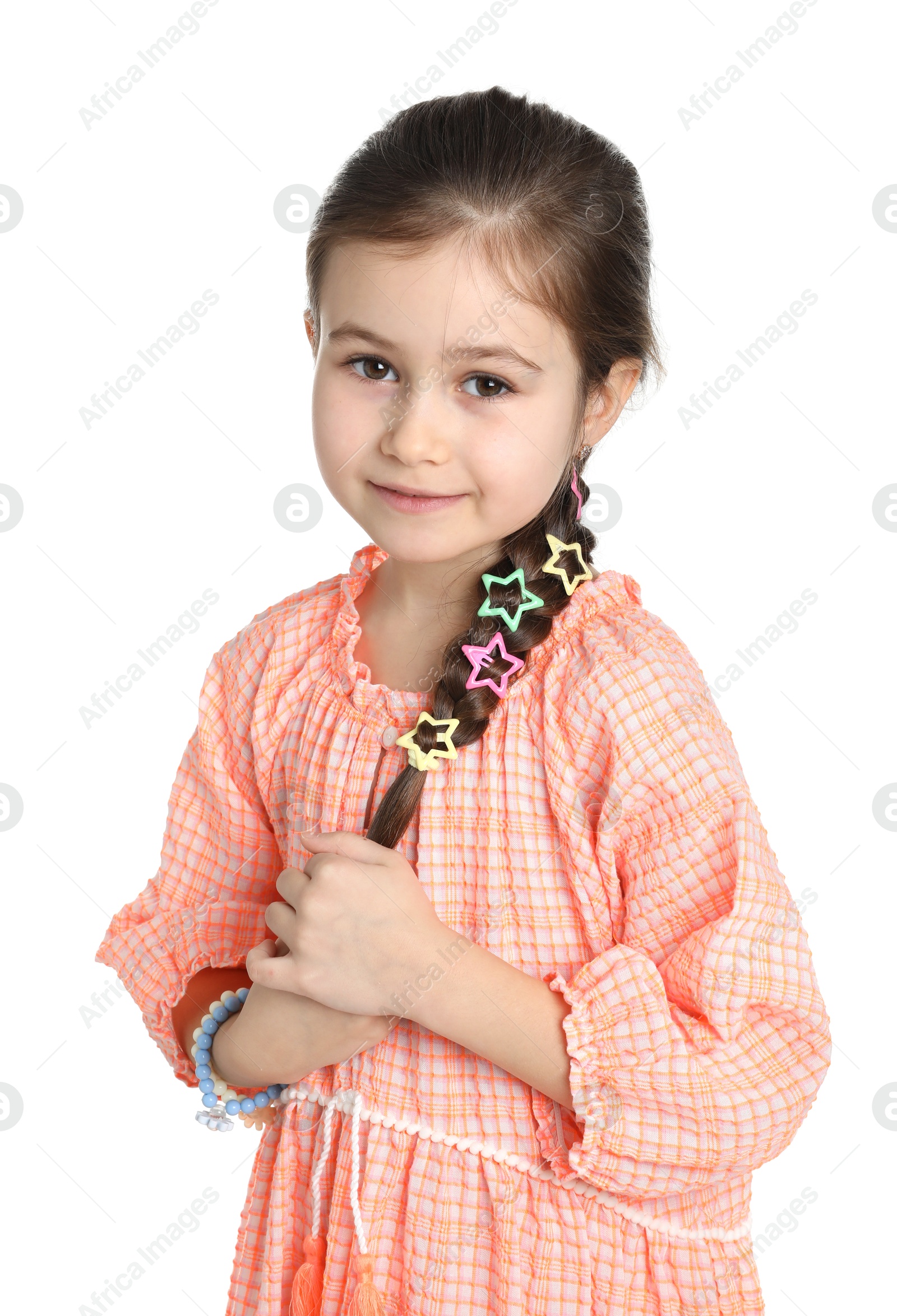 Photo of Little girl wearing beautiful hair accessories on white background