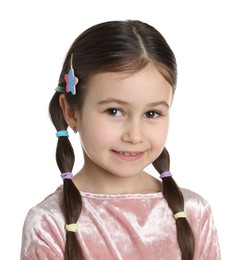 Little girl wearing beautiful hair accessories on white background