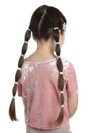 Little girl wearing beautiful hair accessories on white background, back view