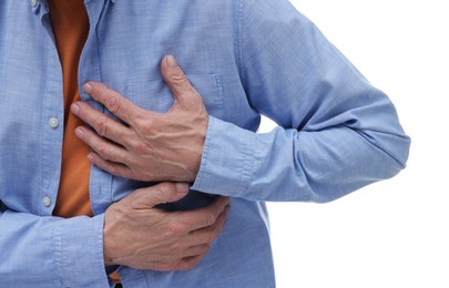 Heart attack. Senior man suffering from pain in chest on white background, closeup