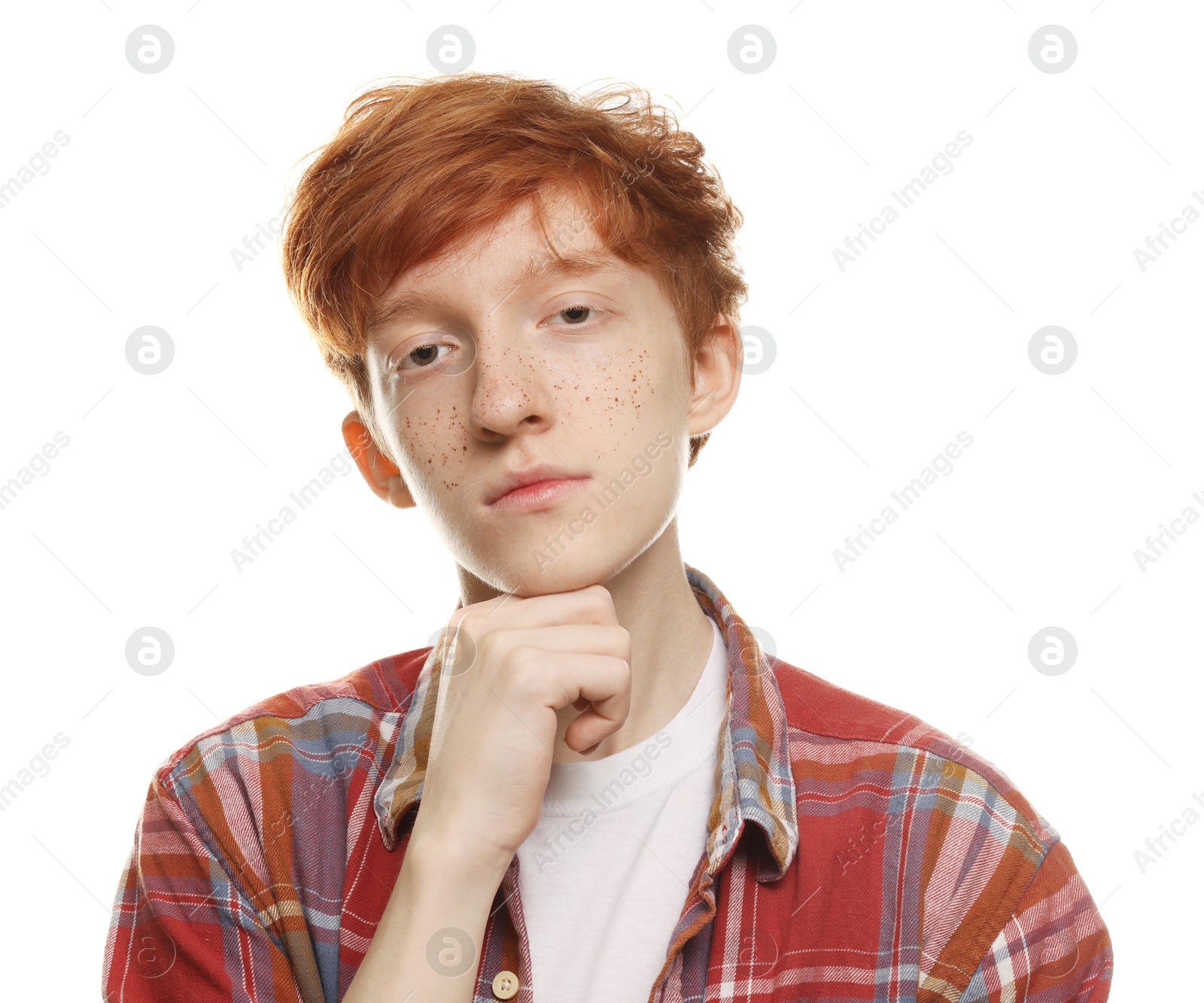 Photo of Portrait of cute teenage boy with freckles on white background