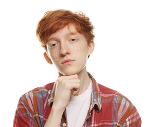 Portrait of cute teenage boy with freckles on white background