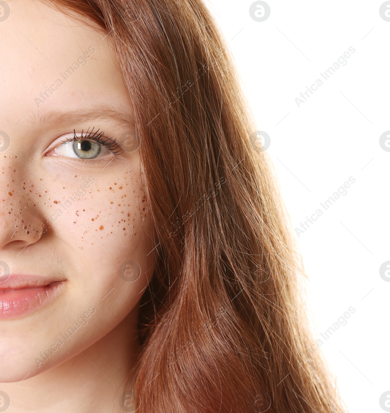 Photo of Beautiful teenage girl with freckles on white background, closeup