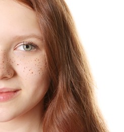 Beautiful teenage girl with freckles on white background, closeup