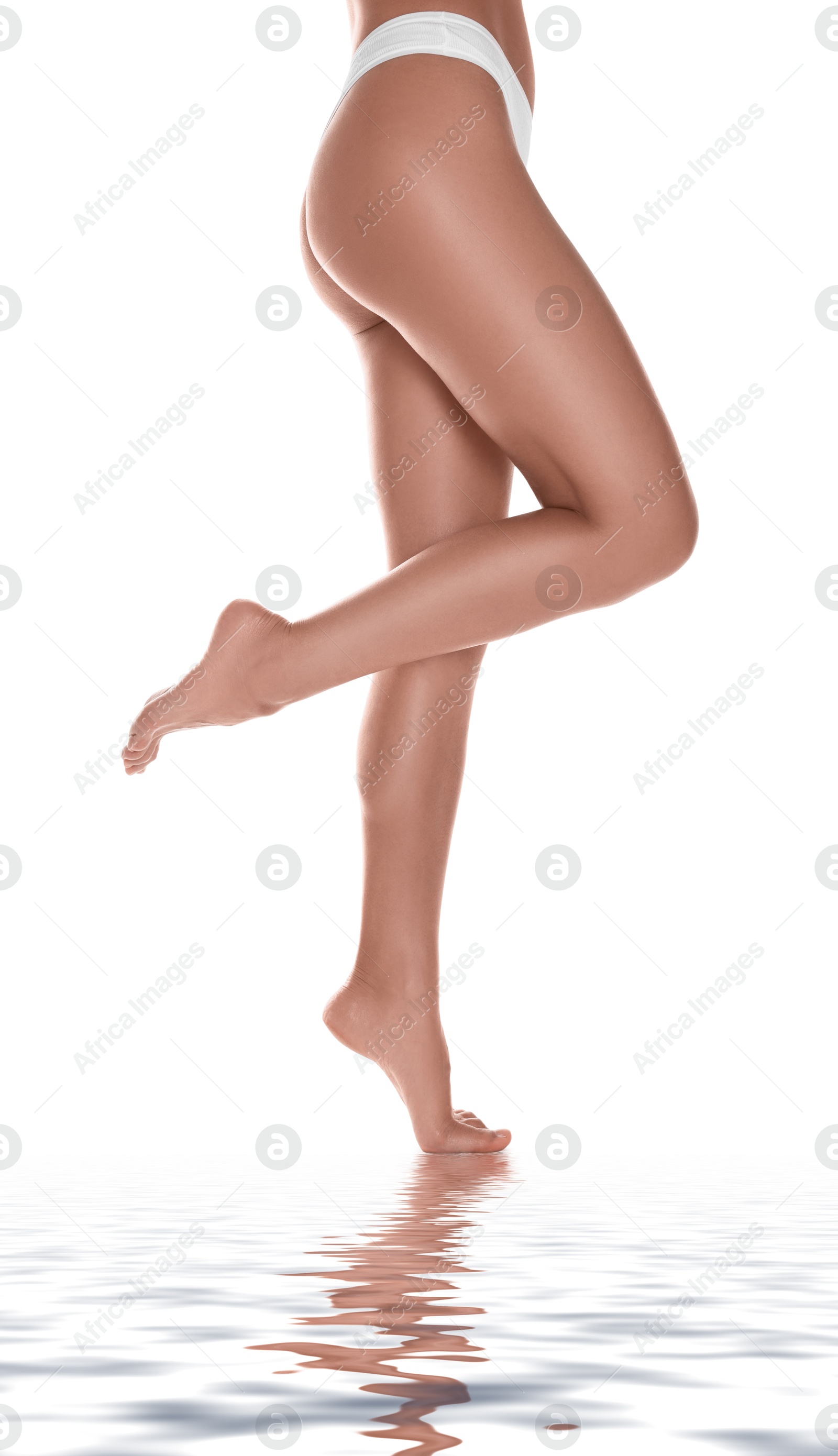 Image of Epilation. Woman showing her legs with smooth soft skin on white background, closeup