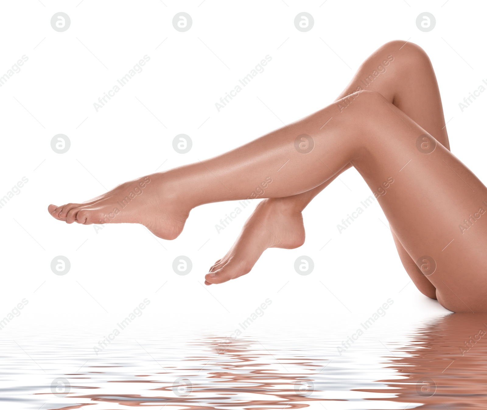 Image of Epilation. Woman showing her legs with smooth soft skin on white background, closeup