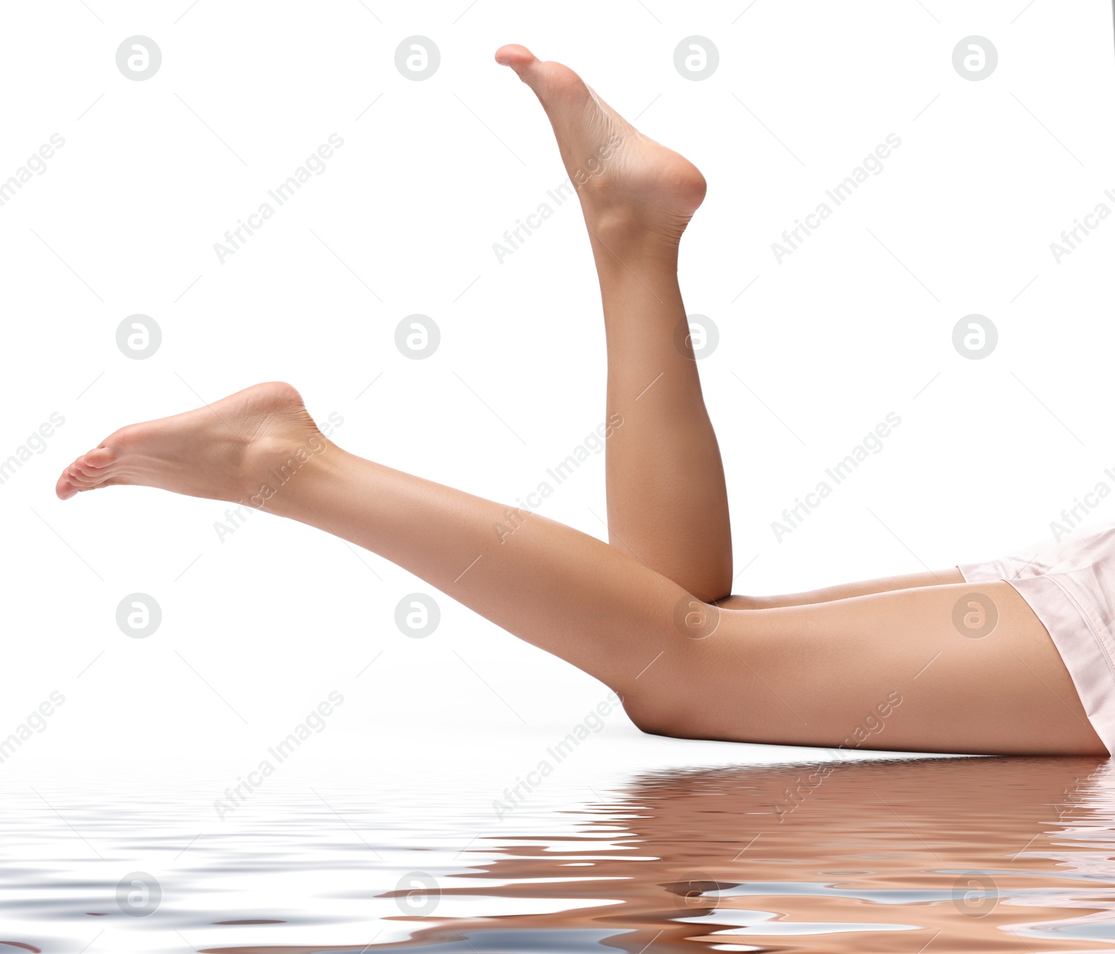 Image of Epilation. Woman showing her legs with smooth soft skin on white background, closeup