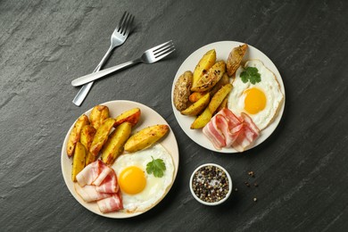 Photo of Flat lay composition with tasty brunch served on dark textured table