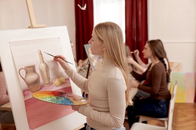 Group of women learning to draw in class