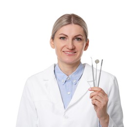 Photo of Professional dentist with tools on white background