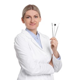 Photo of Professional dentist with tools on white background