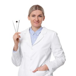 Photo of Professional dentist with tools on white background