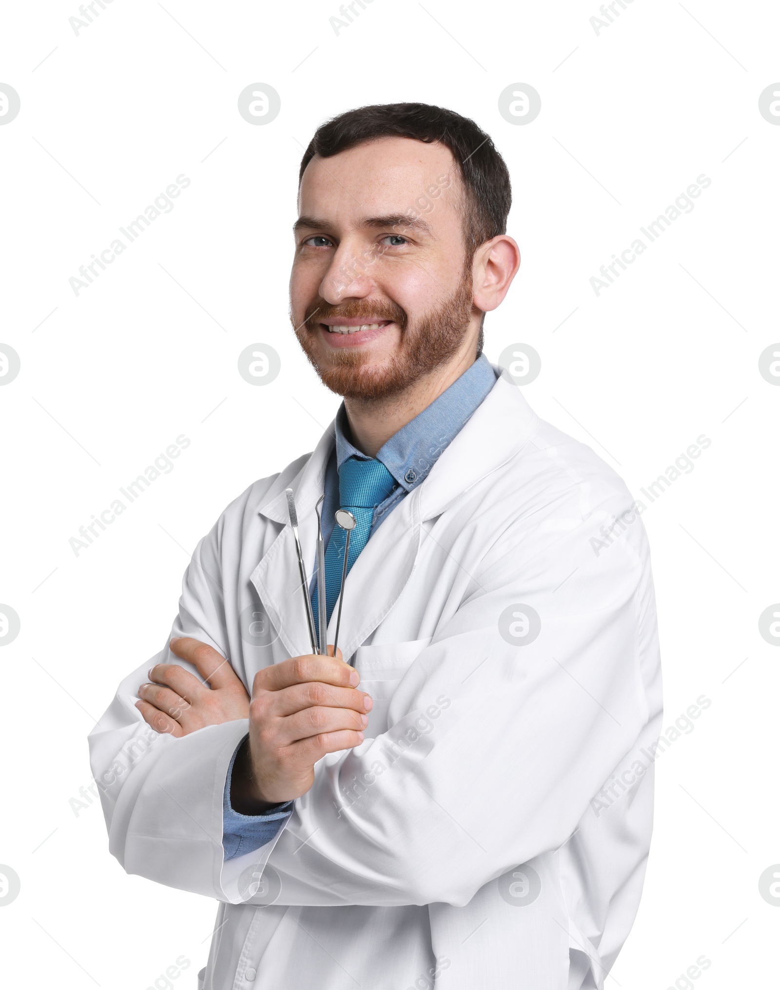 Photo of Professional dentist with tools on white background