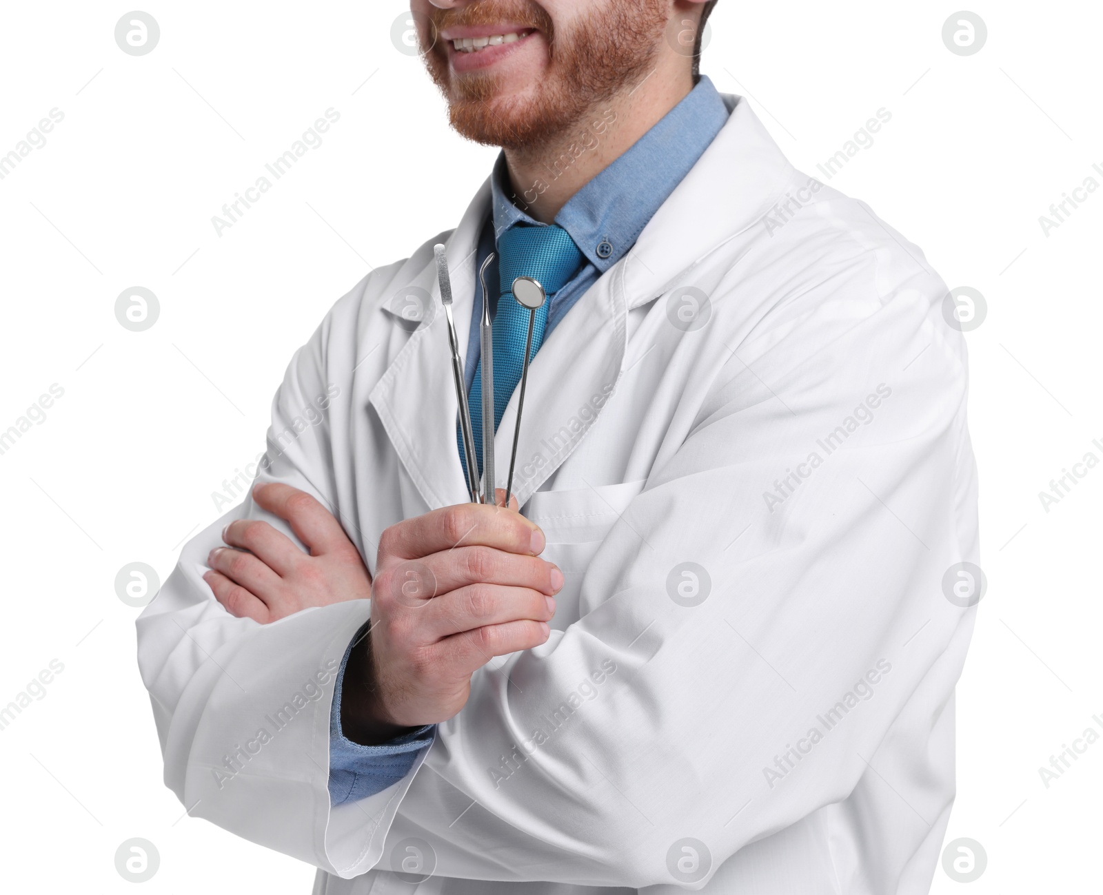 Photo of Professional dentist with tools on white background, closeup