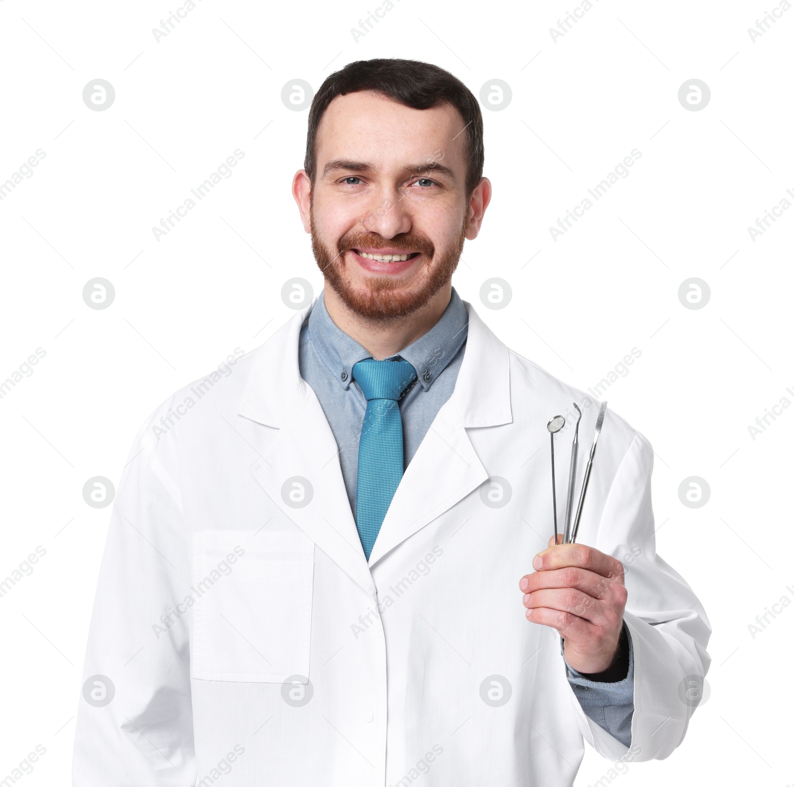 Photo of Professional dentist with tools on white background