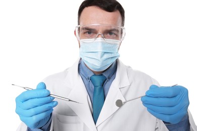 Photo of Professional dentist with tools on white background