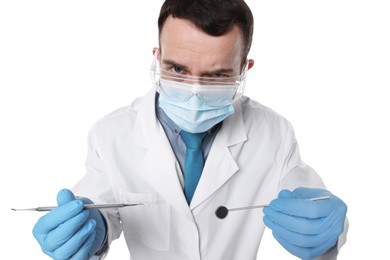 Photo of Professional dentist with tools on white background