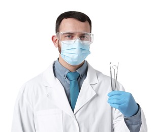 Photo of Professional dentist with tools on white background