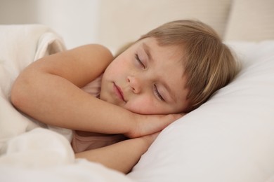 Bedtime. Cute little girl sleeping in bed