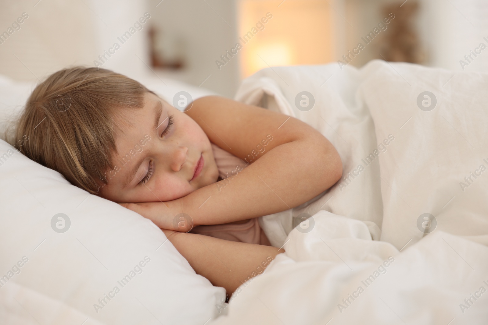 Photo of Bedtime. Cute little girl sleeping in bed