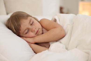 Bedtime. Cute little girl sleeping in bed