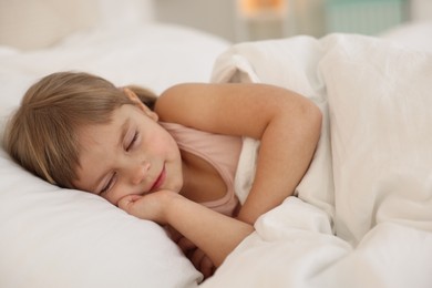 Bedtime. Cute little girl sleeping in bed