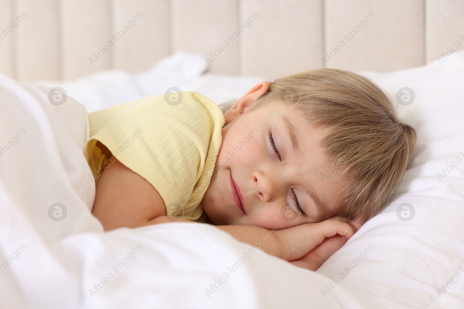 Photo of Bedtime. Cute little girl sleeping in bed