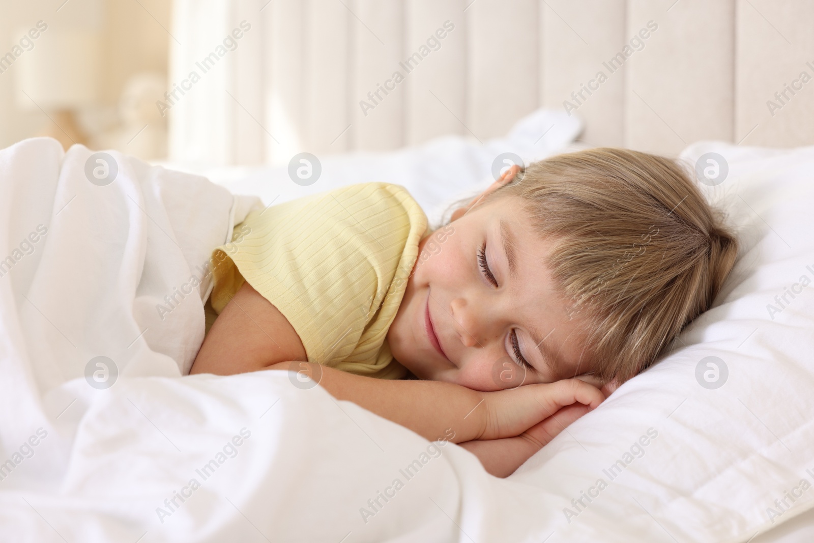 Photo of Bedtime. Cute little girl sleeping in bed