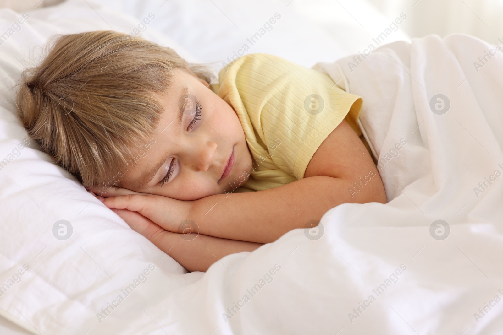 Photo of Bedtime. Cute little girl sleeping in bed