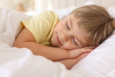 Bedtime. Cute little girl sleeping in bed