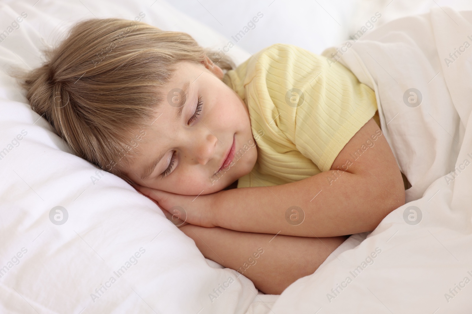 Photo of Bedtime. Cute little girl sleeping in bed