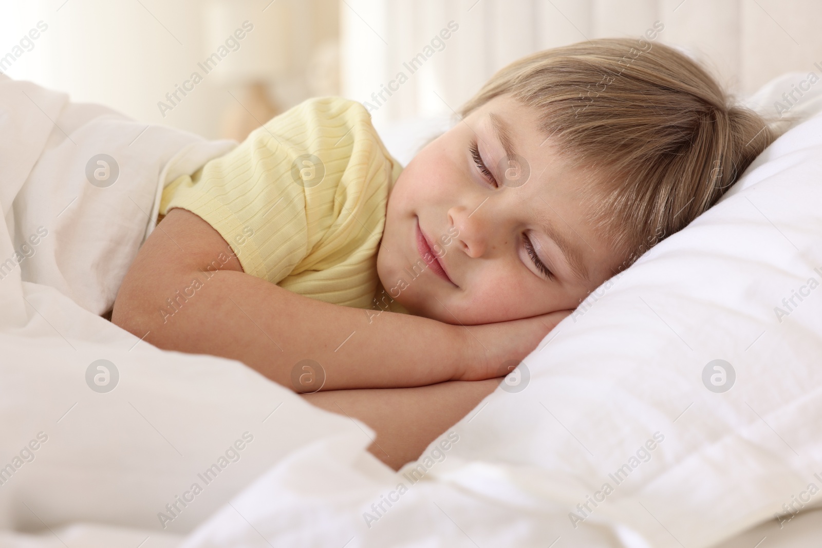 Photo of Bedtime. Cute little girl sleeping in bed