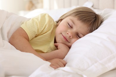 Photo of Bedtime. Cute little girl sleeping in bed