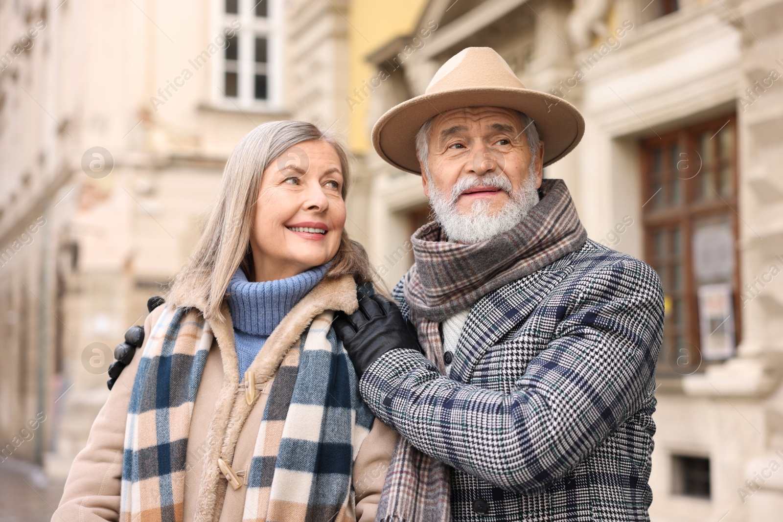 Photo of Lovely elderly couple together on city street