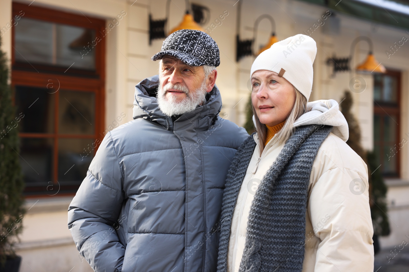 Photo of Lovely elderly couple together on city street