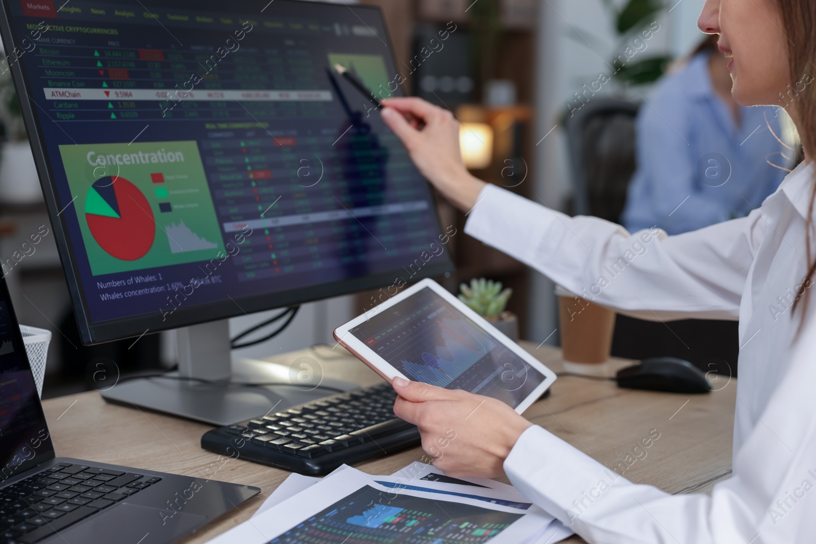 Photo of Stock exchange. Woman working at desk in office, closeup