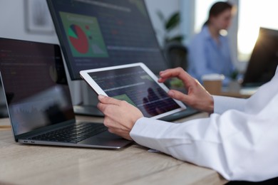 Photo of Stock exchange. Woman working at desk in office, closeup