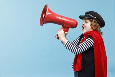 Photo of Cute boy in mime costume shouting in megaphone on light blue background, space for text. Surprise party