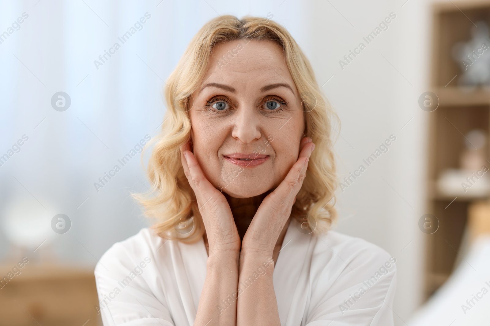 Photo of Portrait of beautiful middle aged woman at home