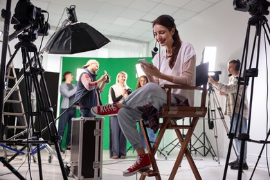 Photo of Group of people working in modern film studio