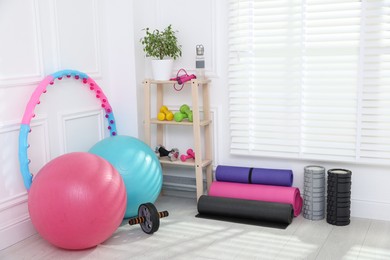 Photo of Many different fitness equipment and accessories indoors