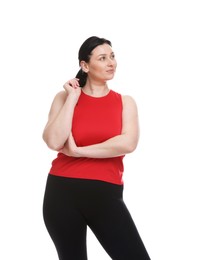 Plus size woman in gym clothes on white background