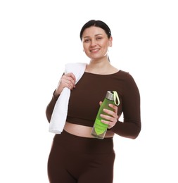 Plus size woman in gym clothes with towel and water bottle on white background